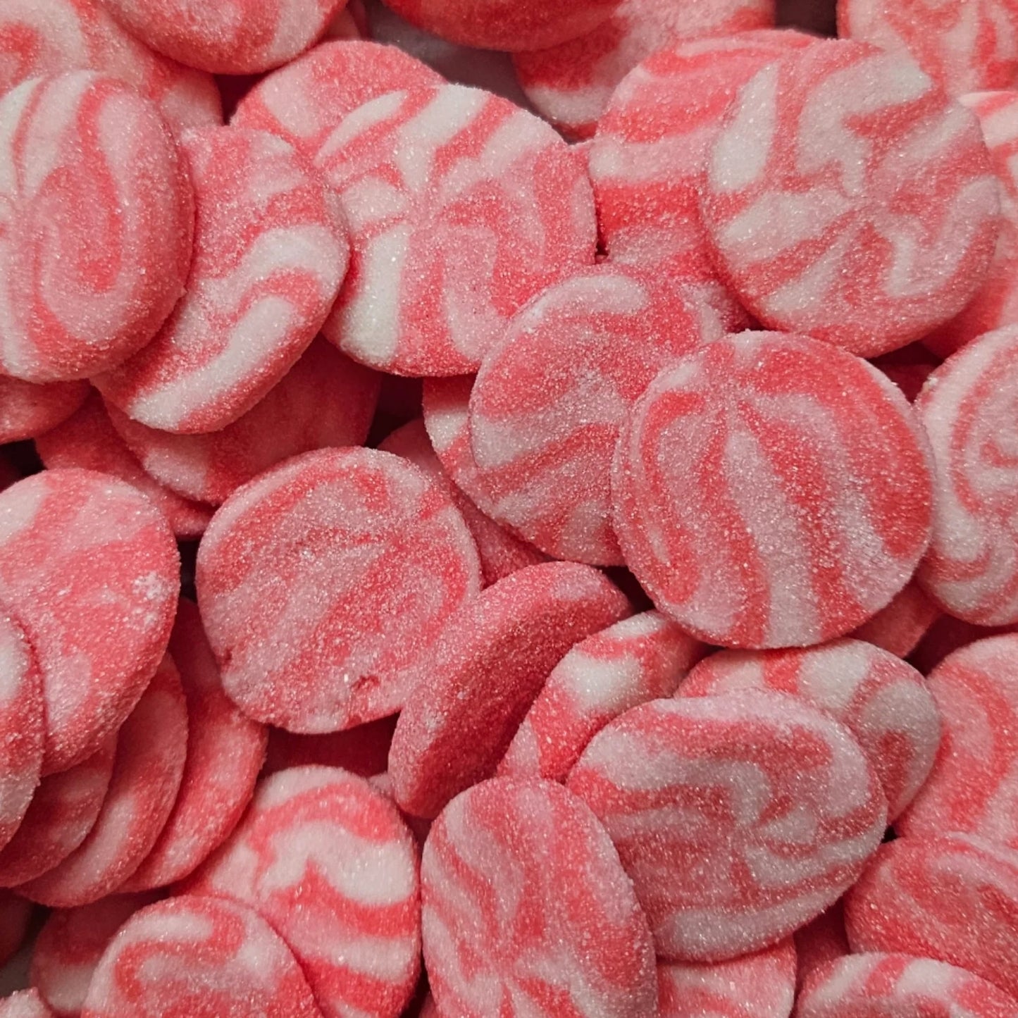 Close-up of pink and white swirled swedish candy